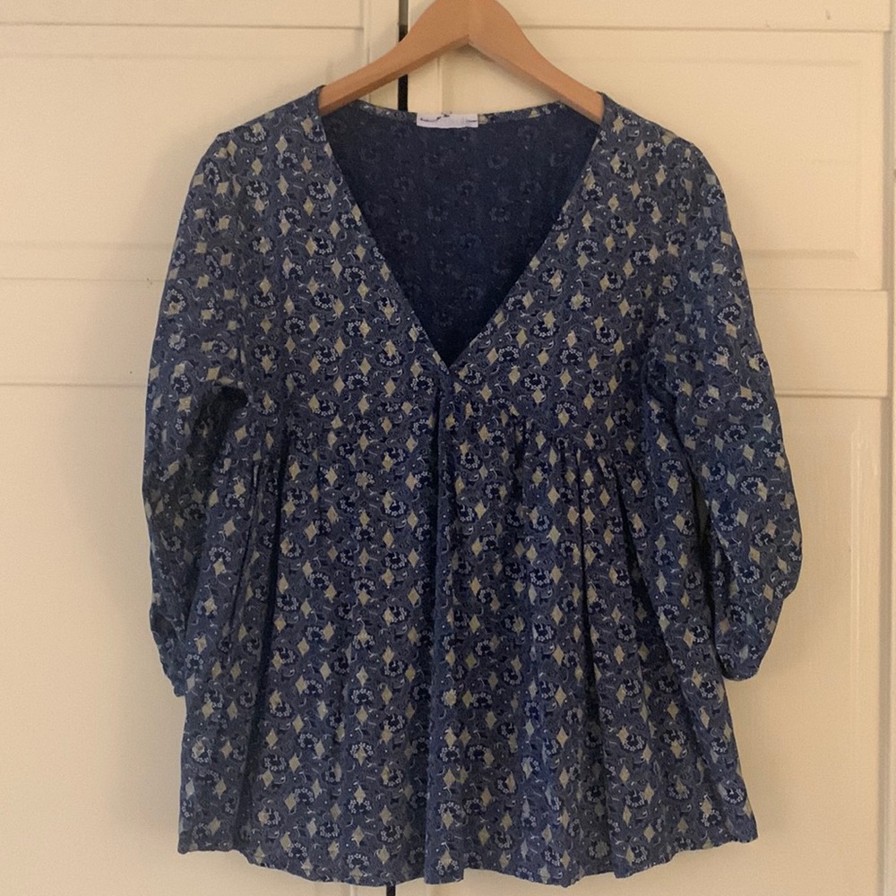 Brand is Andromede Paris. Blue with gold embellishments.